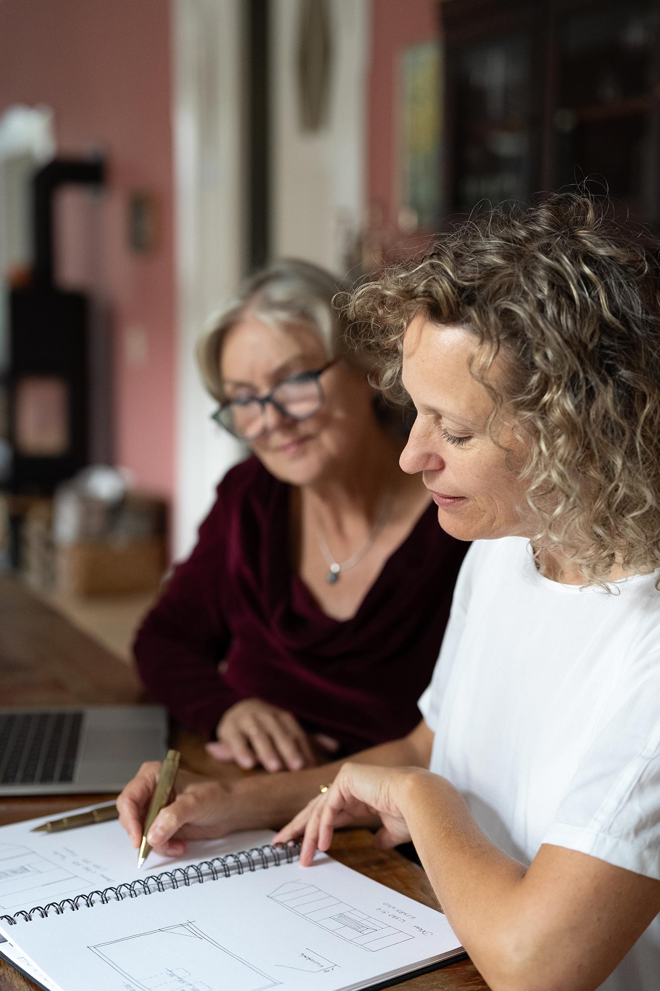 Consultation for planning custom-made furniture with sketches and detailed coordination.